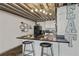 Charming kitchen featuring an island and black appliances, perfect for casual dining at 1111 Osage St # 29, Denver, CO 80204
