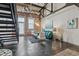Charming living room with exposed brick, concrete floors, modern furniture, and lots of natural light at 1111 Osage St # 29, Denver, CO 80204