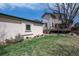 Backyard with detached structure and deck. Green grass and clear blue sky in the background at 2673 S Cook St, Denver, CO 80210