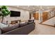 Finished basement featuring a staircase and a comfortable seating area at 2673 S Cook St, Denver, CO 80210
