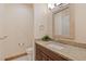 Convenient bathroom with a granite countertop and decorative mirror at 2673 S Cook St, Denver, CO 80210