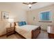 Comfortable bedroom with a ceiling fan and a window at 2673 S Cook St, Denver, CO 80210
