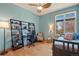 Bright bedroom with a large window, hardwood floors, and a ceiling fan at 2673 S Cook St, Denver, CO 80210