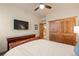 Cozy bedroom with wood accents, sliding closet doors, and natural light at 2673 S Cook St, Denver, CO 80210