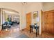 Bright foyer leading to a cozy living room, featuring tile floors, wood trim, and a welcoming atmosphere at 2673 S Cook St, Denver, CO 80210