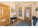 Inviting foyer featuring an art niche, stylish front door, and wood accents, creating a warm entrance at 2673 S Cook St, Denver, CO 80210
