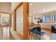 Hallway featuring frosted glass windows, wood floors, and wrought iron railing on the staircase at 2673 S Cook St, Denver, CO 80210