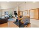 Bright living space featuring wood floors, an exercise bike, and an open staircase with iron railing at 2673 S Cook St, Denver, CO 80210