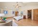 Bright primary bedroom offering vaulted ceilings, wood floors, and ample natural light at 2673 S Cook St, Denver, CO 80210