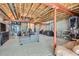 Spacious unfinished basement with exposed ceiling and room for customization and extra storage at 12856 Jasmine St # E, Thornton, CO 80602