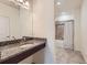 Bright bathroom featuring granite counters and a combination shower and bathtub at 12856 Jasmine St # E, Thornton, CO 80602