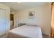 Comfortable bedroom with a small bed and neutral tones at 12856 Jasmine St # E, Thornton, CO 80602