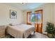 Bright bedroom with natural light and window views, cozy and inviting space at 12856 Jasmine St # E, Thornton, CO 80602