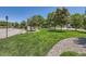 Community green space and landscaping with plenty of green grass at 12856 Jasmine St # E, Thornton, CO 80602