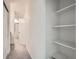 Hallway with built in shelves at 12856 Jasmine St # E, Thornton, CO 80602