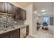 Modern kitchen featuring stainless steel appliances, granite countertops and decorative backsplash at 12856 Jasmine St # E, Thornton, CO 80602