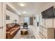 Comfortable living room with wood floors, stylish furniture, and plenty of space for relaxing at 12856 Jasmine St # E, Thornton, CO 80602