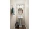 Charming powder room featuring a pedestal sink and stylish fixtures at 908 Cinnamon Ln, Louisville, CO 80027