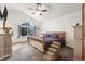 Bright bedroom showcasing a vaulted ceiling, large window, and unique bed setup at 908 Cinnamon Ln, Louisville, CO 80027