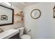 Charming half bathroom features floating wood shelves, mirror and lovely decorations at 717 S Carr Ave, Lafayette, CO 80026