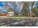 Attractive two-story home featuring mature landscaping, a lawn, and an attached two car garage at 717 S Carr Ave, Lafayette, CO 80026
