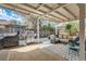Covered patio with a grill, lounge seating, and space for outdoor entertainment at 717 S Carr Ave, Lafayette, CO 80026