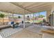 Covered patio offering a comfortable seating area, an open area, and views of the backyard at 717 S Carr Ave, Lafayette, CO 80026