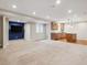 Spacious basement featuring an open concept with a kitchen and TV area, ideal for entertaining at 10440 Lowell Ct, Westminster, CO 80031