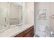 Charming powder room features a decorative mirror and sink vanity with a coastal-themed wall accent at 10440 Lowell Ct, Westminster, CO 80031