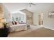 Spacious bedroom with lots of natural light, large windows, and neutral carpet at 10440 Lowell Ct, Westminster, CO 80031