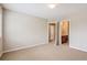 Bright, neutral bedroom features a spacious layout and access to a private ensuite bathroom at 10440 Lowell Ct, Westminster, CO 80031