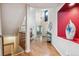 Bright foyer boasts wood floors, staircase, and decorative niche, offering a grand entrance at 10440 Lowell Ct, Westminster, CO 80031