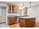 Basement kitchen boasts stainless steel appliances, wood cabinets, and a peninsula bar at 10440 Lowell Ct, Westminster, CO 80031