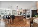 Spacious kitchen featuring a large island with bar seating and modern appliances at 10440 Lowell Ct, Westminster, CO 80031