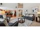 Open-concept living room flows into the kitchen, great for entertaining guests and enjoying views at 10440 Lowell Ct, Westminster, CO 80031