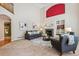 Inviting living room with high ceilings, fireplace, large windows, and neutral decor at 10440 Lowell Ct, Westminster, CO 80031