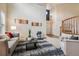 Bright living room with high ceilings, neutral décor, and open access to the entry at 10440 Lowell Ct, Westminster, CO 80031