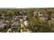 A lovely view from above of the home, yard, and neighborhood with mature trees at 2235 Eaton St, Edgewater, CO 80214