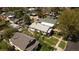 Overhead view of the home showing yard and roof, plus surrounding neighborhood with trees at 2235 Eaton St, Edgewater, CO 80214