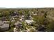 Aerial picture of the home within its neighborhood featuring mature trees and mountain views at 2235 Eaton St, Edgewater, CO 80214