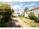 Expansive backyard with potential for customization, featuring a detached garage and lush greenery at 2235 Eaton St, Edgewater, CO 80214