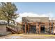 Modern commercial building with outdoor seating, ideal for dining or entertainment experiences at 2235 Eaton St, Edgewater, CO 80214