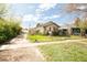 Charming single story home with a well maintained front yard and cozy curb appeal at 2235 Eaton St, Edgewater, CO 80214