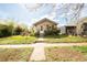 Charming single story home featuring a well maintained front yard with walkway to front door at 2235 Eaton St, Edgewater, CO 80214