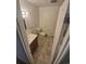 Bathroom featuring a tub and standard toilet, vanity and mirror at 867 S Grape St, Denver, CO 80246