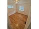 Bedroom with wood floors, bright window, and minimalist design at 867 S Grape St, Denver, CO 80246