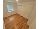 Bedroom featuring wood floors, closet, and natural light at 867 S Grape St, Denver, CO 80246