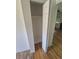 Interior closet view featuring a standard closet, hardwood floors, and natural lighting at 867 S Grape St, Denver, CO 80246