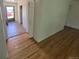 Hardwood flooring in a bright entry way and doorway view of the red car outside at 867 S Grape St, Denver, CO 80246