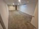 Spacious finished basement with carpet, drop ceiling, and good lighting at 867 S Grape St, Denver, CO 80246